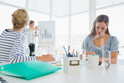 Casual business people in office at presentation