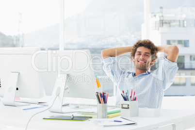 Relaxed casual business man with computer in bright office