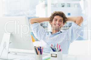 Casual young man with computer in a bright office
