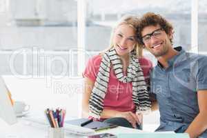 Portrait of a smiling casual business couple
