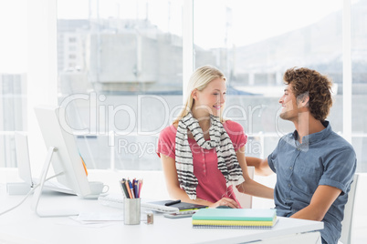 Casual business couple in a bright office