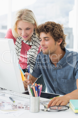 Casual couple using computer