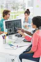 Artists working at desk in creative office