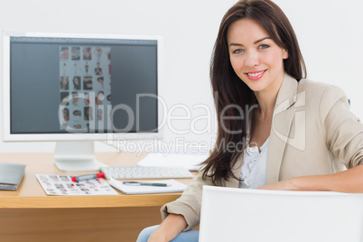 Female artist at desk with computer in the office