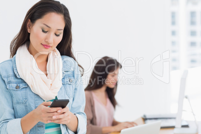 Woman text messaging in office