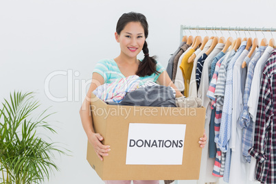 Young woman with clothes donation