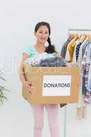 Young woman with clothes donation