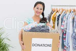Young woman with clothes donation
