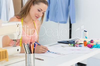 Female fashion designer working on her designs