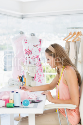 Female fashion designer working on her designs