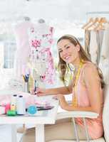 Portrait of a fashion designer working on her designs