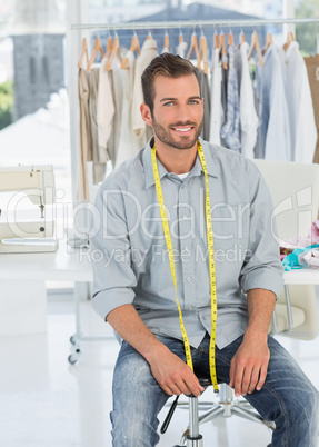 Portrait of a male fashion designer in studio