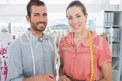 Fashion designers at work in bright studio