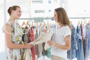 Young women shopping in clothes store