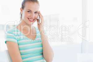 Portrait of a beautiful young woman using mobile phone