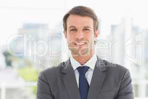 Businessman standing over blurred background outdoors