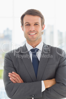 Portrait of a businessman with arms crossed outdoors