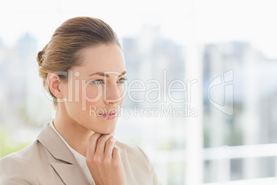 Close-up of a young businesswoman looking away