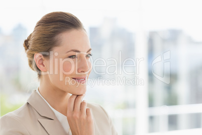 Close-up of a young businesswoman looking away
