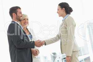 Executives shaking hands after a business meeting