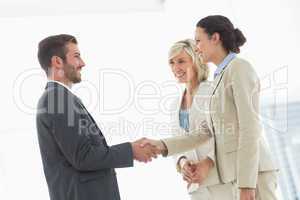 Executives shaking hands after a business meeting