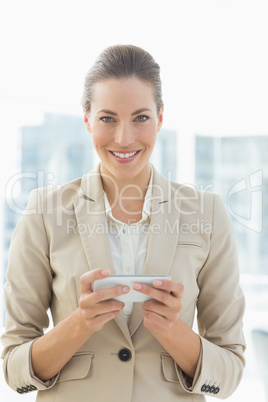 Portrait of a beautiful businesswoman text messaging
