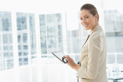 Beautiful businesswoman using digital tablet in office