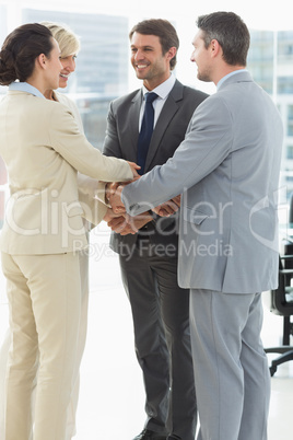 Business team joining hands together