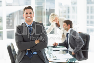 Businessman with colleagues discussing in office