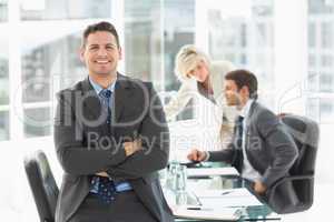 Businessman with colleagues discussing in office