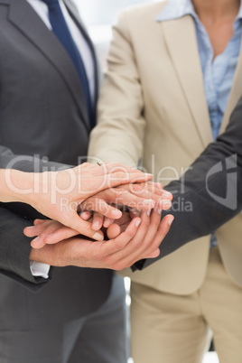 Business team joining hands together