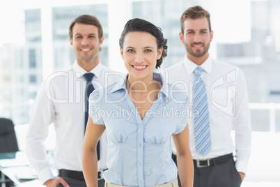 Confident smiling business team in office