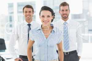 Confident smiling business team in office