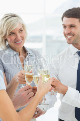 Business team toasting with champagne in office