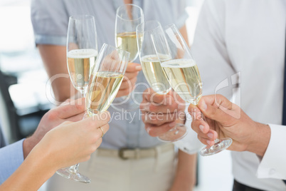 Hands toasting with champagne