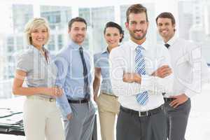 Confident business team together in office