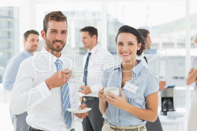 Business colleagues with tea cups during break
