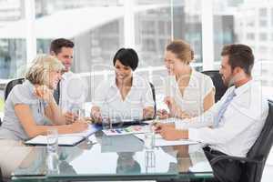 Young well dressed business people in meeting