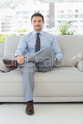 Portrait of a well dressed young man at home