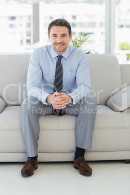 Portrait of a well dressed young man at home