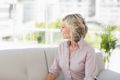 Thoughtful mature woman at home