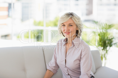 Portrait of a mature woman sitting at home
