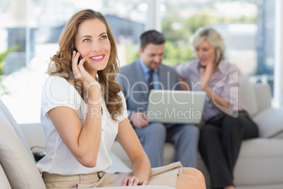 Businesswoman on call with colleagues using laptop