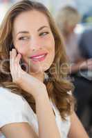 Beautiful businesswoman using mobile phone