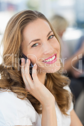 Beautiful businesswoman using mobile phone