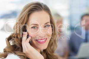 Beautiful businesswoman using mobile phone