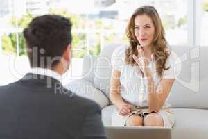 Smiling woman in meeting with a financial adviser