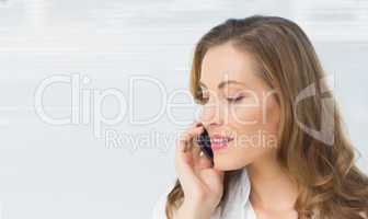 Close-up of a beautiful young businesswoman using cellphone