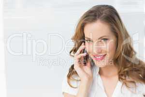 Close-up of a beautiful businesswoman using cellphone