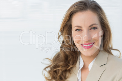 Close-up portrait of a smiling young businesswoman